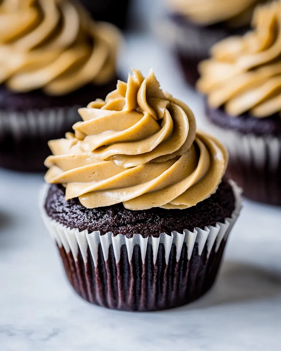 Delicious Dark Chocolate Cupcakes with Peanut Butter Frosting food shot
